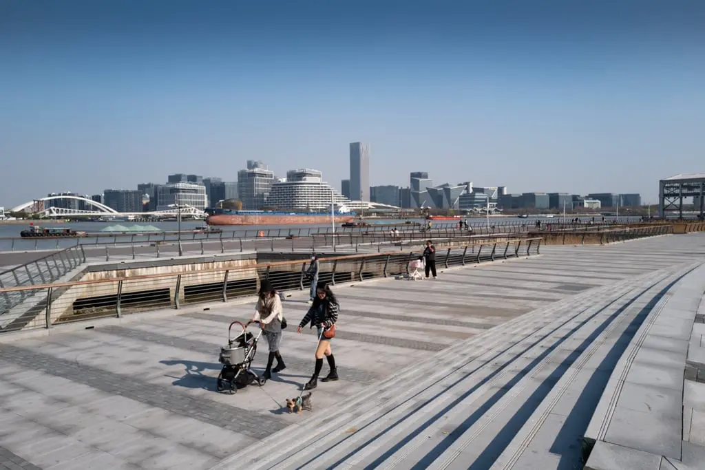 West Bund riverside promenade in Shanghai with modern skyline views